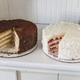Two homemade layer cakes on a kitchen counter